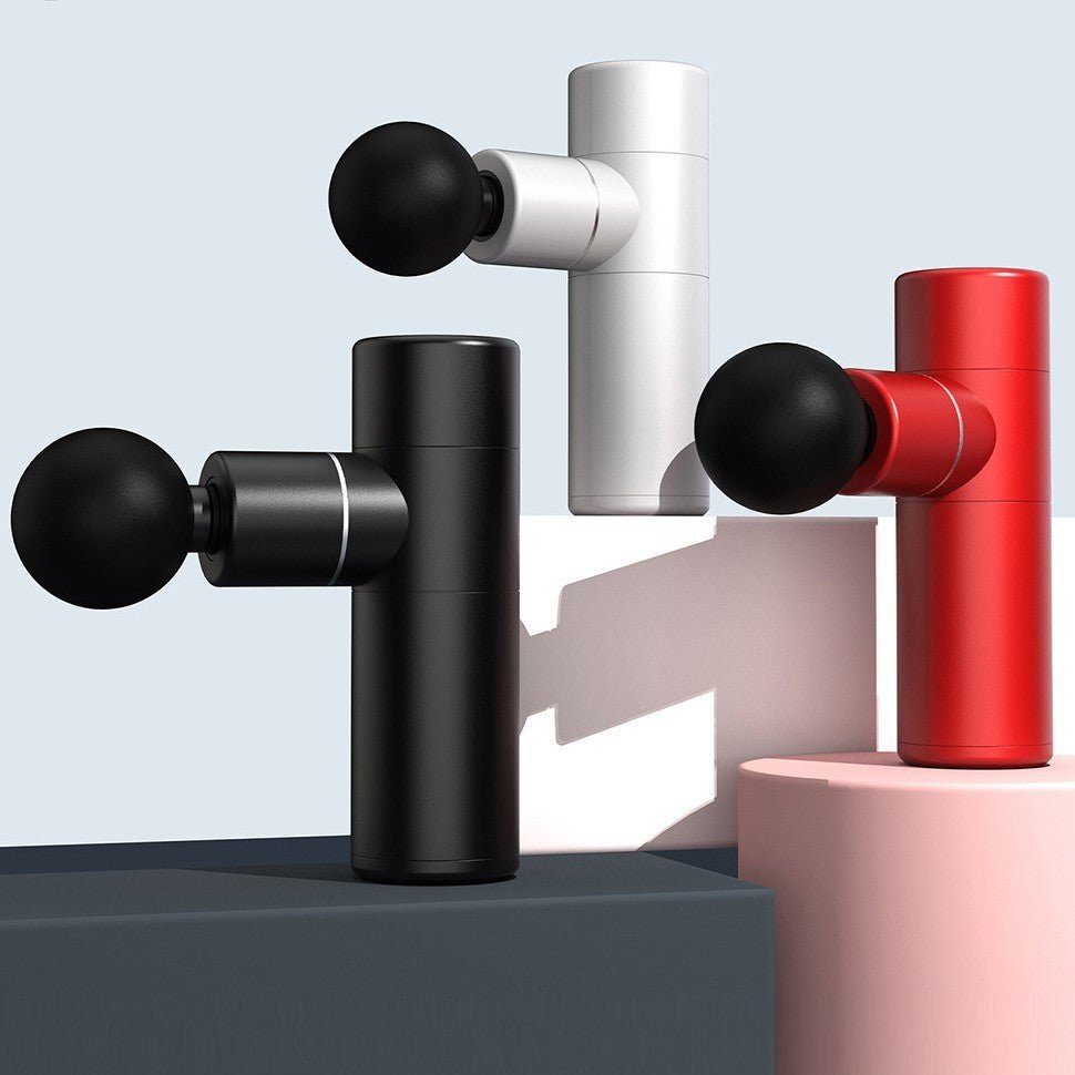 Three compact Aloha Relax massage guns, featuring a brushless motor for quiet operation, are displayed on geometric podiums in black, white, and red against a light background. Each mini portable device has a cylindrical body and spherical massage head for easy use with deep muscle relief in 30 seconds.