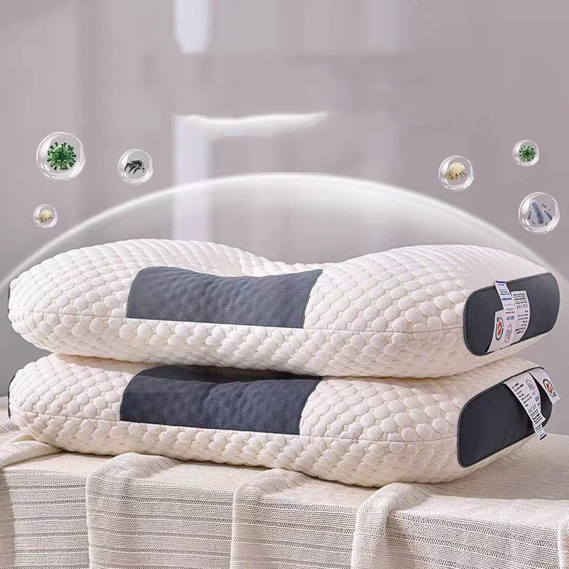 Two 3D Knitted Cotton Pillow Sleep Aids from Aloha Relax, featuring a honeycomb-like texture and dark grey accents, are stacked on a light-colored fabric surface. Small bubbles containing various images float around the pillows, enhancing the Aloha Relax atmosphere. The background is blurred.