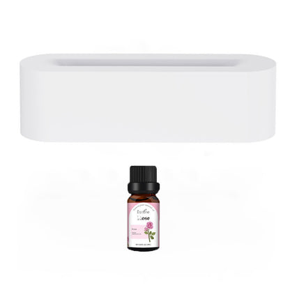 An "Aloha Relax Flame Aroma Diffuser" sits elegantly in front of a white, rectangular shelf with a hollow center, making it perfect for enhancing any aroma diffuser setup. The minimalist backdrop highlights its potential to infuse your space with serenity using this ultrasonic cool mist maker and essential oil lamp.