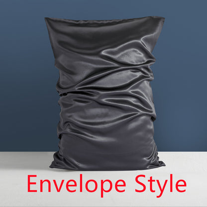 The Double-sided Silk Sleep Pillowcase by Aloha Relax, featuring a luxurious dark gray color and crafted from mulberry silk with a subtle wrinkled texture, is showcased against a blue wall. The phrase "Envelope Style" appears prominently in large red letters at the bottom, highlighting its elegant design.