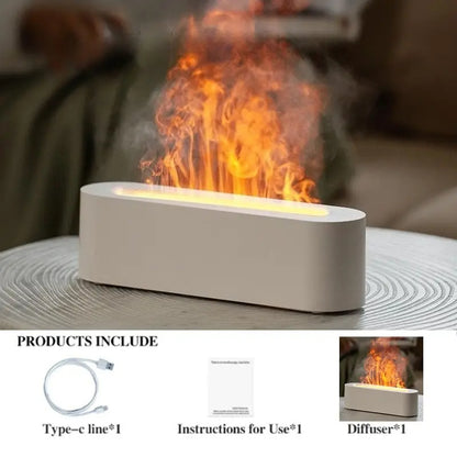 An Aloha Relax Flame Aroma Diffuser Air Humidifier, designed in a rectangular shape, rests on the table, casting a mist with a fire-like effect. This ultrasonic device enhances the ambiance with 7 color options for a calming atmosphere. Accompanying the diffuser is packaging that includes a Type-C cable, instructions, and the diffuser itself.